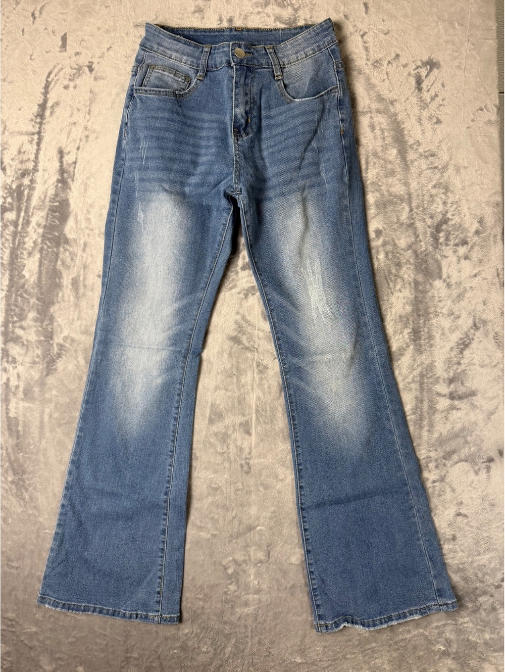 Light Wash Blue Denim Flared Jeans with Raw Hem